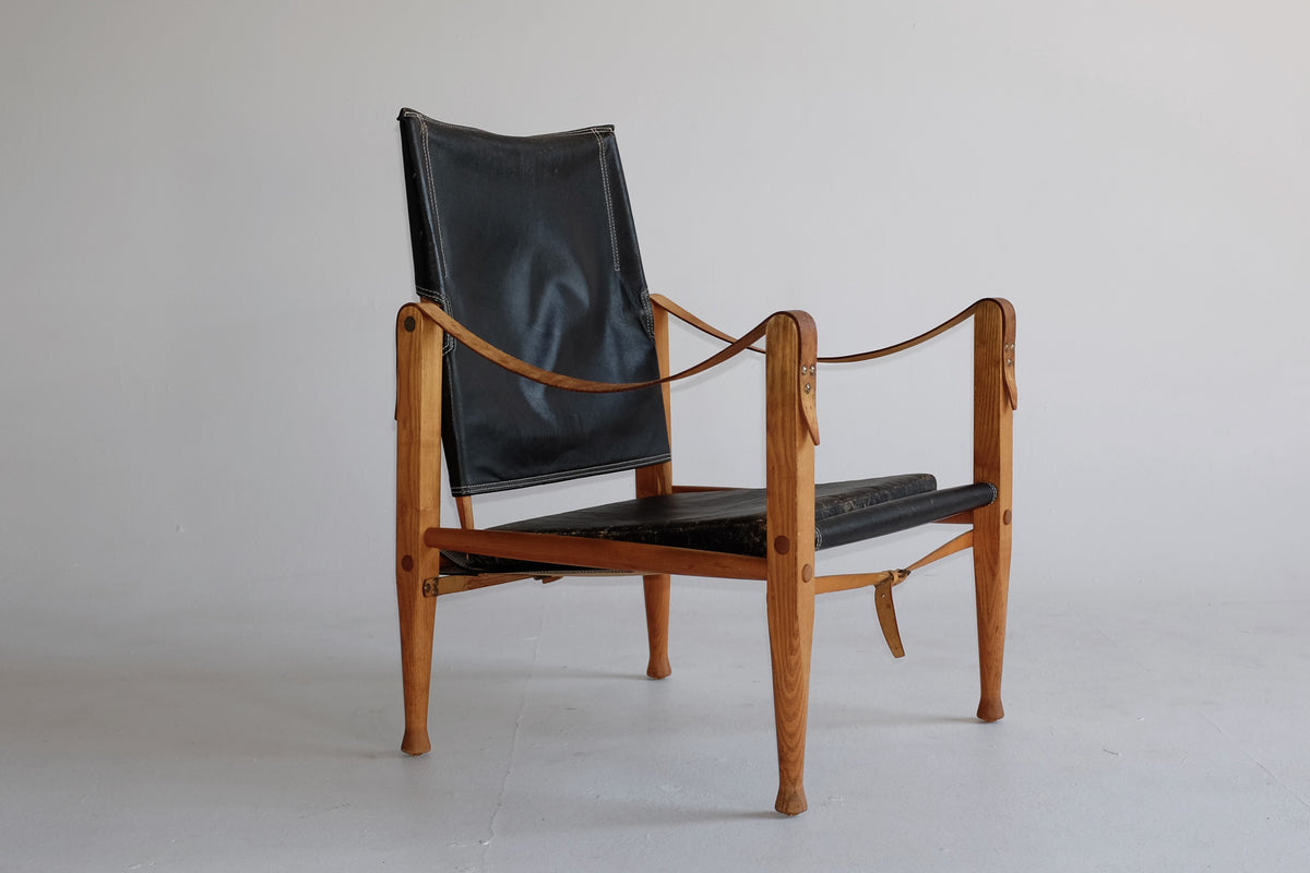 Mid-Century Safari Stuhl mit Sling Armlehnen aus schwarzem Leder, Gestell  aus Buchenholz & Stoffbezug von Kaare Klint, 1950er bei Pamono kaufen